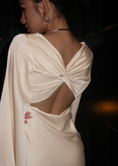 Noir Luxe – Satin Mini Dress with Dramatic Cape Sleeves