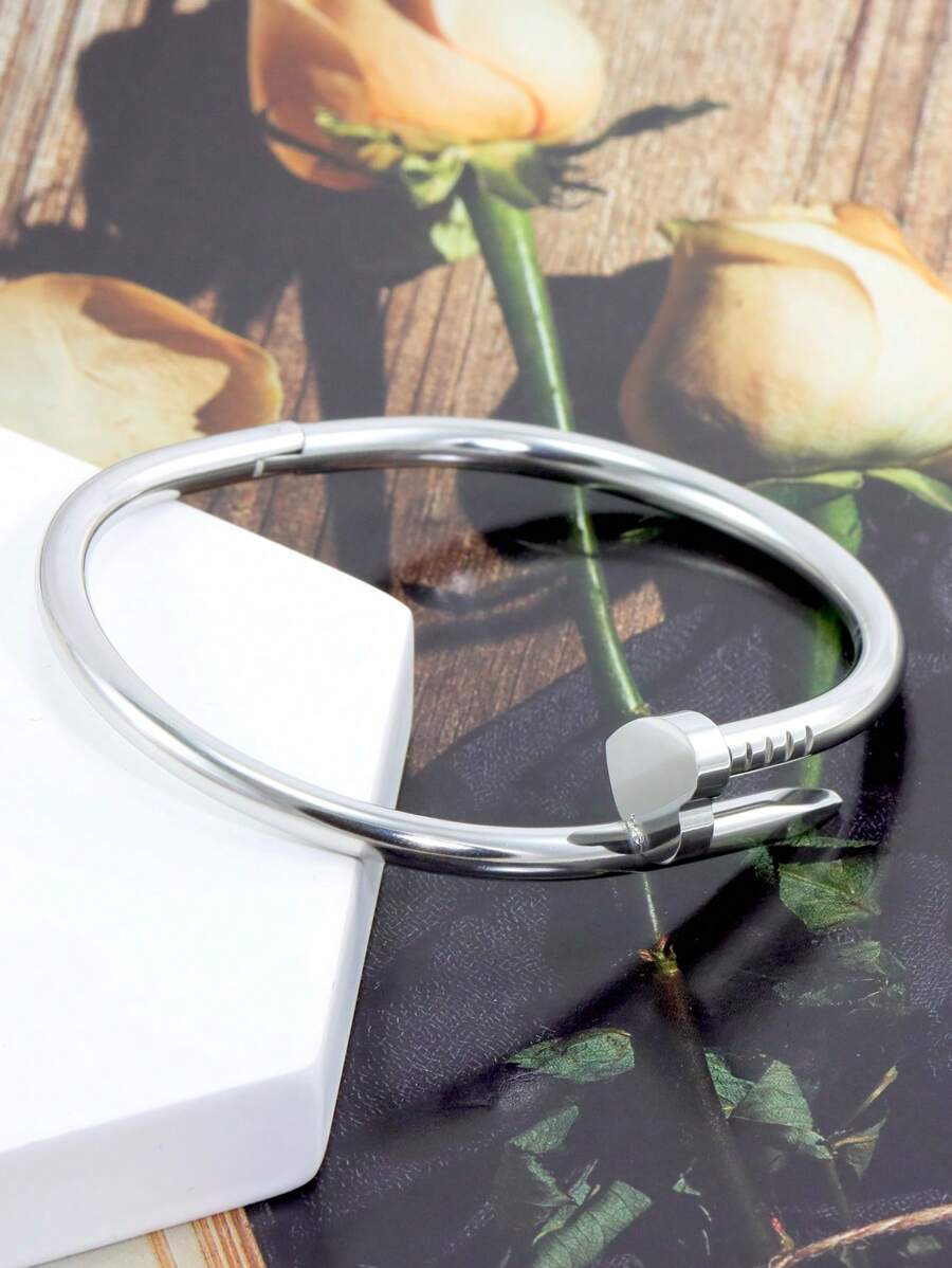 Gleaming Gold Tone Stainless Steel Four Leaf Clover Bangle