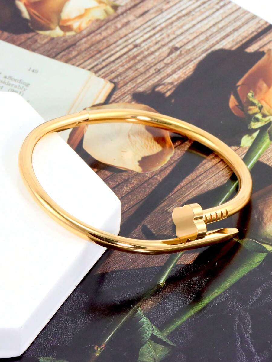 Gleaming Gold Tone Stainless Steel Four Leaf Clover Bangle