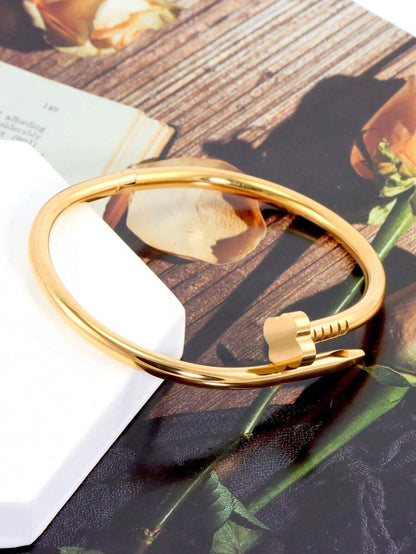 Gleaming Gold Tone Stainless Steel Four Leaf Clover Bangle